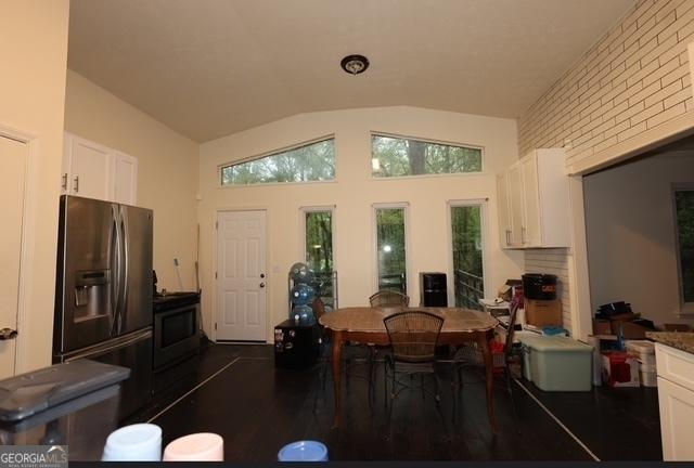 185 Windhaven Trl SW, Atlanta, GA 30331 - dining space featuring lofted ceiling and dark wood-style floors