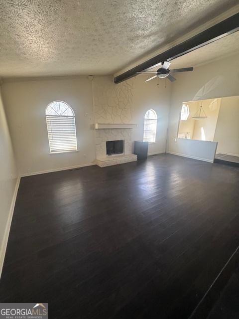 185 Windhaven Trl SW, Atlanta, GA 30331 - unfurnished living room featuring a textured ceiling, dark wood-type flooring, and baseboards