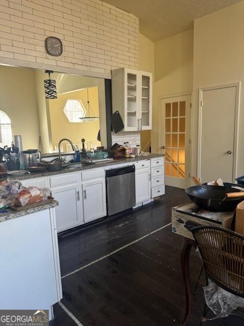 185 Windhaven Trl SW, Atlanta, GA 30331 - kitchen featuring dishwasher, white cabinets, glass insert cabinets, a sink, and dark wood-type flooring