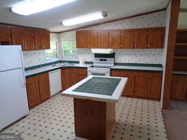 kitchen featuring light floors, lofted ceiling, white appliances, and wallpapered walls