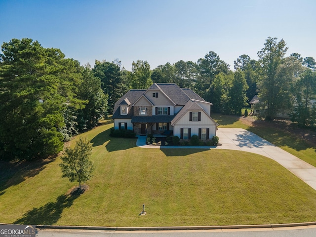 50 Brook Trl, Newnan, GA 30265 - view of front of home with concrete driveway, board and batten siding, and a front yard