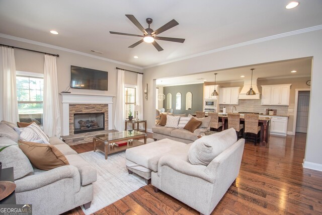 50 Brook Trl, Newnan, GA 30265 - living room featuring a ceiling fan, ornamental molding, and dark wood finished floors