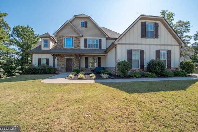 50 Brook Trl, Newnan, GA 30265 - craftsman-style house featuring stone siding, board and batten siding, a shingled roof, and a front lawn