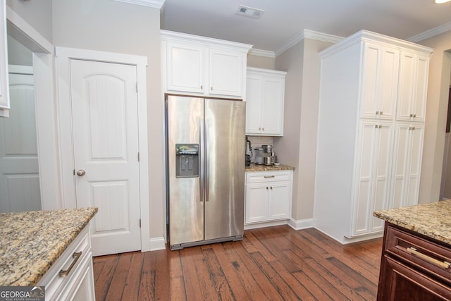 50 Brook Trl, Newnan, GA 30265 - kitchen featuring stainless steel fridge, dark wood finished floors, visible vents, baseboards, and white cabinetry