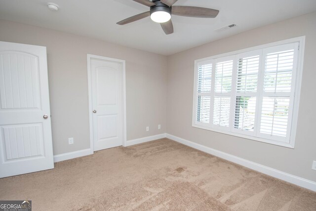 50 Brook Trl, Newnan, GA 30265 - unfurnished bedroom with visible vents, baseboards, ceiling fan, and carpet floors