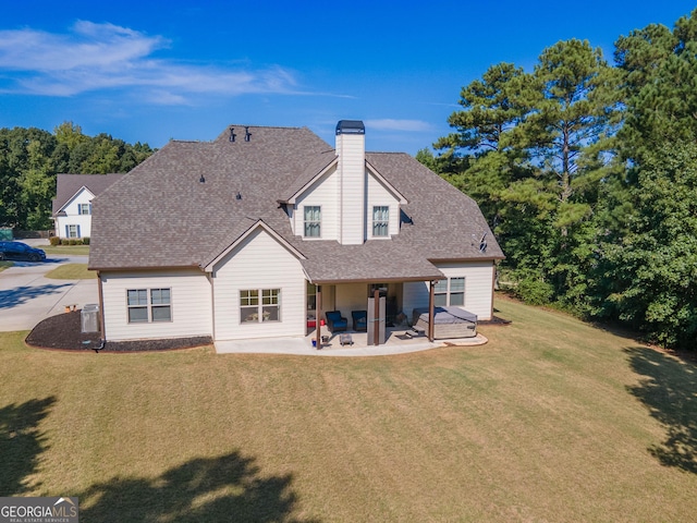 50 Brook Trl, Newnan, GA 30265 - back of property featuring a chimney, a yard, a patio, and a shingled roof
