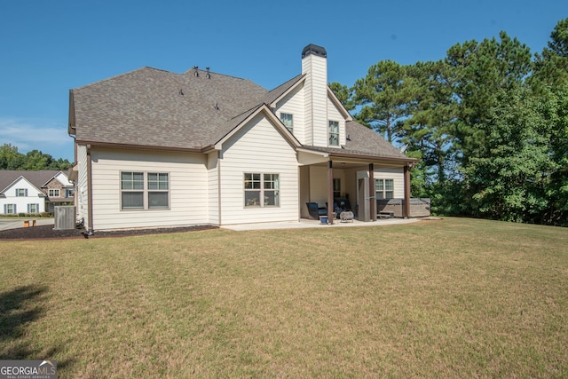 50 Brook Trl, Newnan, GA 30265 - rear view of property with central air condition unit, a patio area, a yard, a chimney, and a shingled roof