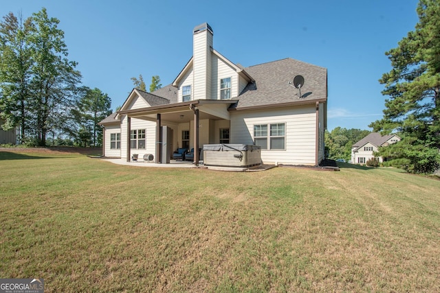 50 Brook Trl, Newnan, GA 30265 - rear view of house with a lawn, a chimney, a patio, and a hot tub