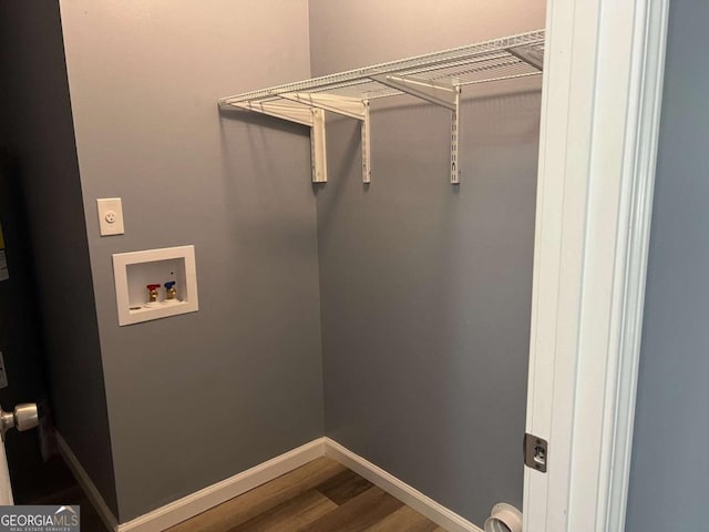 laundry area with wood finished floors, laundry area, washer hookup, hookup for an electric dryer, and baseboards