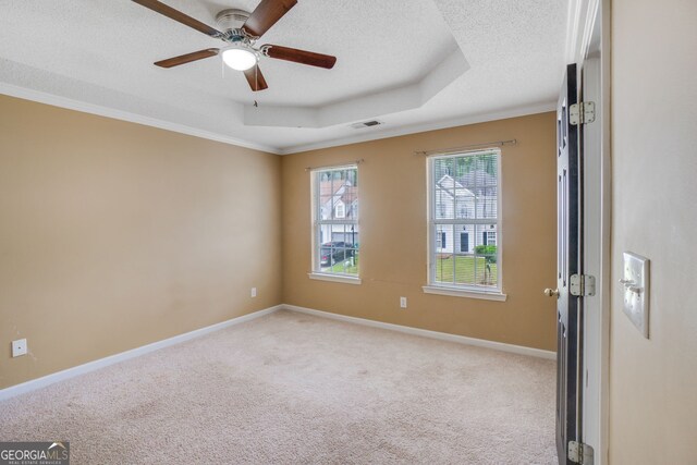 3550 Willow Tree Trce, Decatur, GA 30034 - spare room featuring light colored carpet, a textured ceiling, a ceiling fan, baseboards, and crown molding