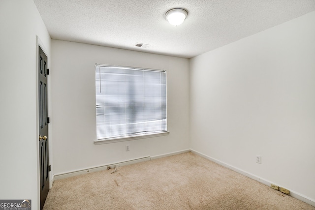 3550 Willow Tree Trce, Decatur, GA 30034 - spare room featuring carpet floors, healthy amount of natural light, a textured ceiling, and baseboards