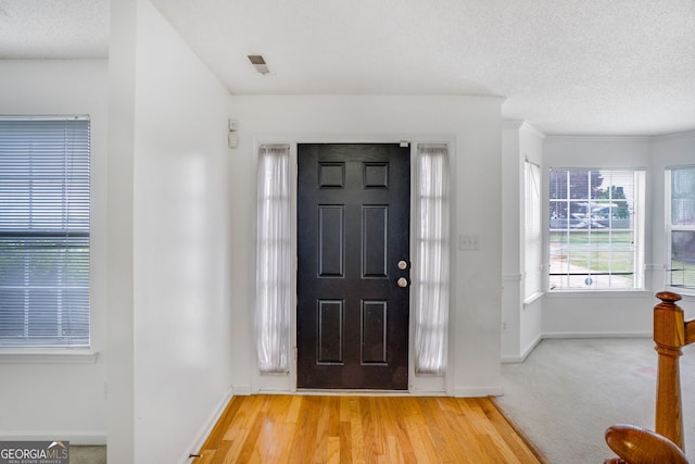 3550 Willow Tree Trce, Decatur, GA 30034 - entrance foyer with baseboards, a textured ceiling, and light wood-type flooring