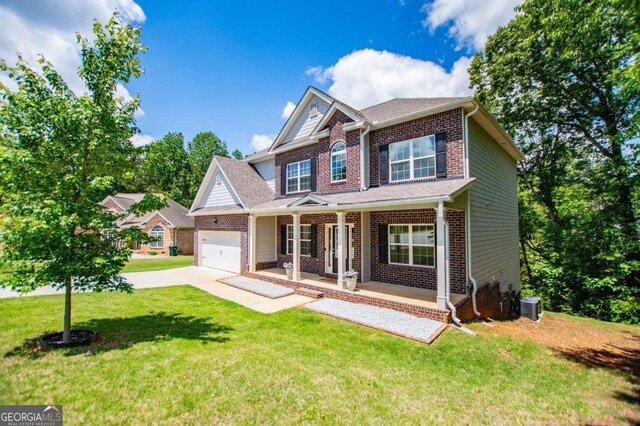 craftsman-style home featuring a porch, brick siding, concrete driveway, central AC unit, and an attached garage