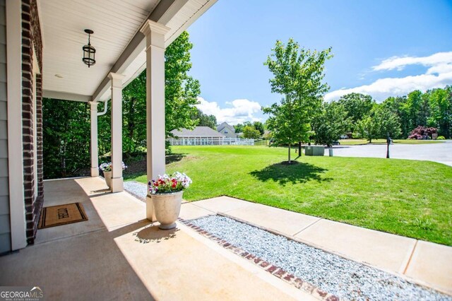 view of patio featuring a porch
