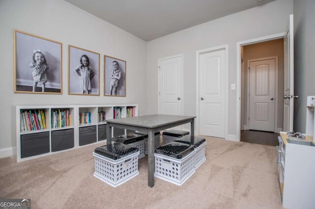 carpeted office space with baseboards