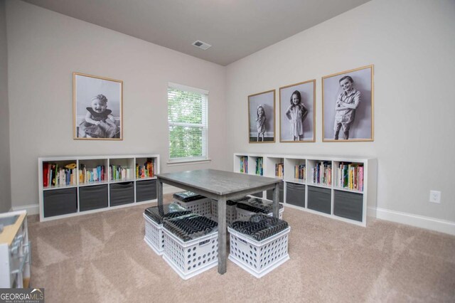 playroom featuring carpet flooring and baseboards