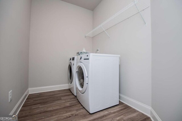 spare room with dark wood finished floors, baseboards, and recessed lighting