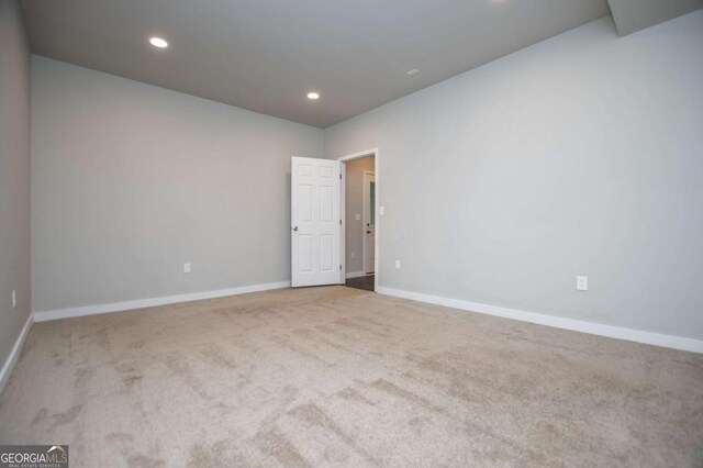 laundry room featuring washer / clothes dryer, wood finish floors, and baseboards