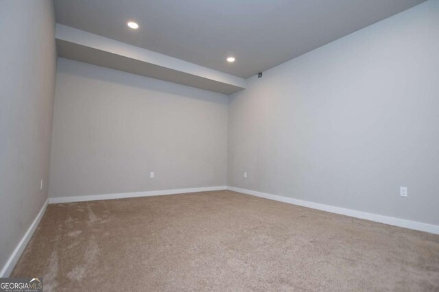 unfurnished bedroom with carpet floors, baseboards, and a closet