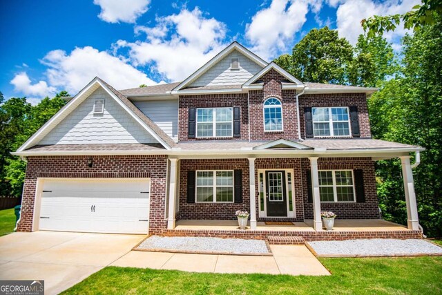 craftsman inspired home with a porch and brick siding