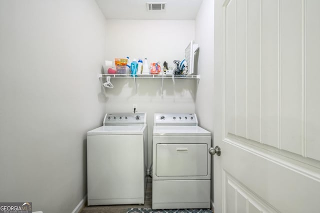 laundry area with independent washer and dryer