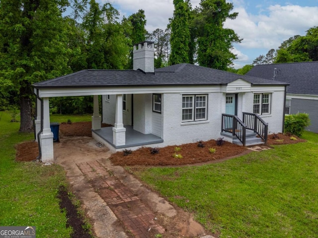 2137 Delowe Dr, Atlanta, GA 30344 - view of front of property with driveway, brick siding, a front lawn, and covered porch