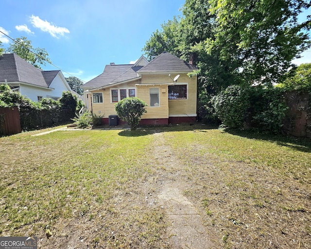 view of front facade featuring central AC and crawl space