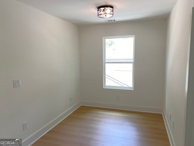 2167 Main St NW, Atlanta, GA 30318 - spare room featuring light wood-type flooring, baseboards, and visible vents