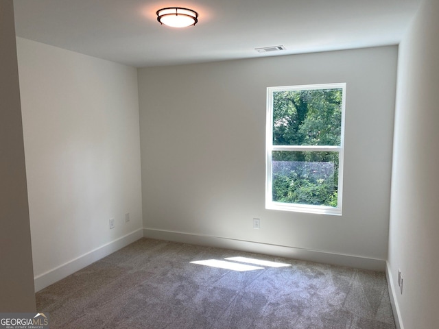 2167 Main St NW, Atlanta, GA 30318 - carpeted empty room with visible vents and baseboards