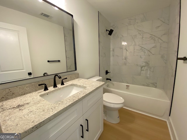 2167 Main St NW, Atlanta, GA 30318 - bathroom featuring shower / bathtub combination, toilet, visible vents, vanity, and wood finished floors