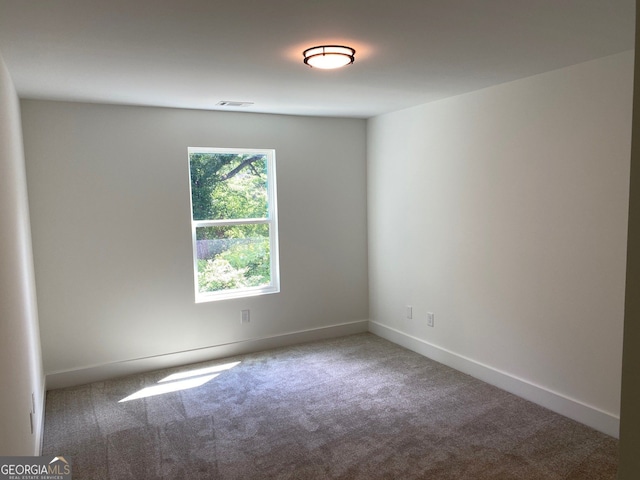 2167 Main St NW, Atlanta, GA 30318 - spare room featuring carpet, baseboards, and visible vents