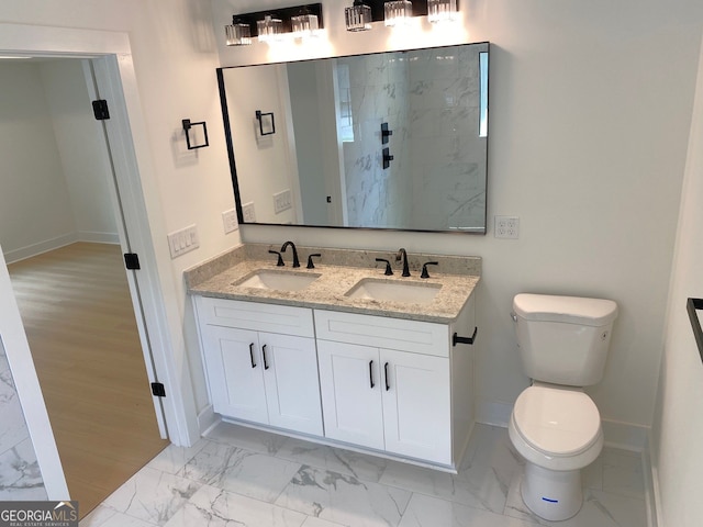 2167 Main St NW, Atlanta, GA 30318 - bathroom featuring baseboards, marble finish floor, and a sink