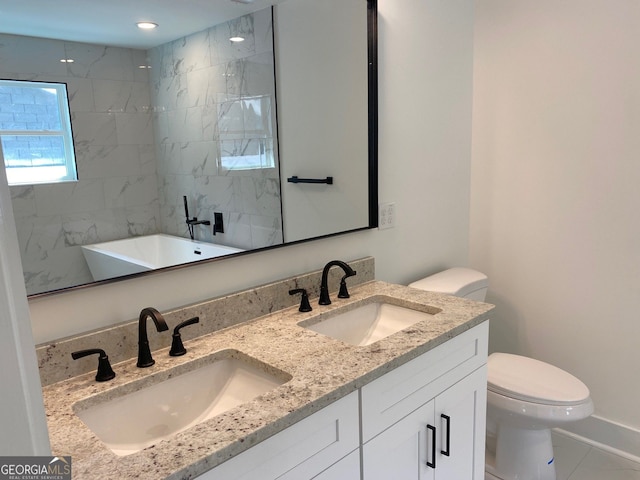 2167 Main St NW, Atlanta, GA 30318 - full bathroom featuring toilet, a freestanding tub, double vanity, and a sink