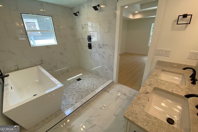 2167 Main St NW, Atlanta, GA 30318 - bathroom with a tile shower, marble finish floor, double vanity, and a sink