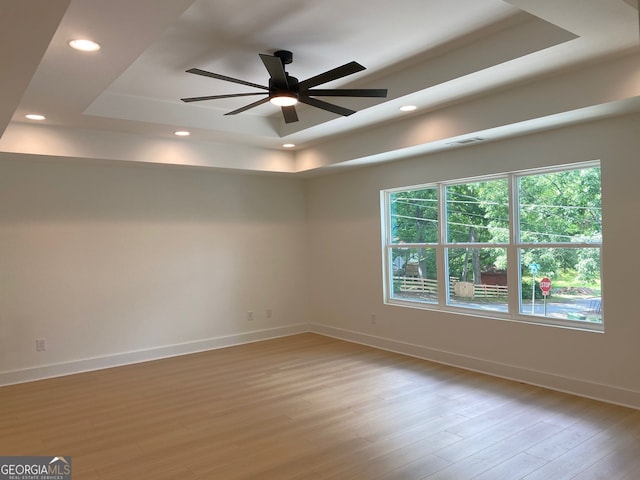 2167 Main St NW, Atlanta, GA 30318 - unfurnished room featuring light wood-type flooring, visible vents, recessed lighting, a raised ceiling, and baseboards