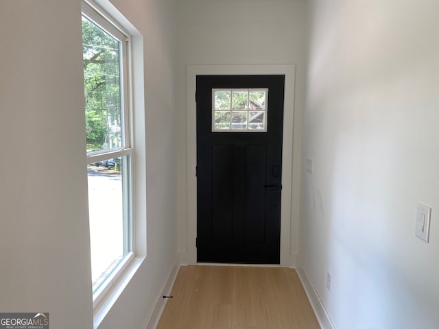 2167 Main St NW, Atlanta, GA 30318 - doorway with baseboards and light wood-style floors