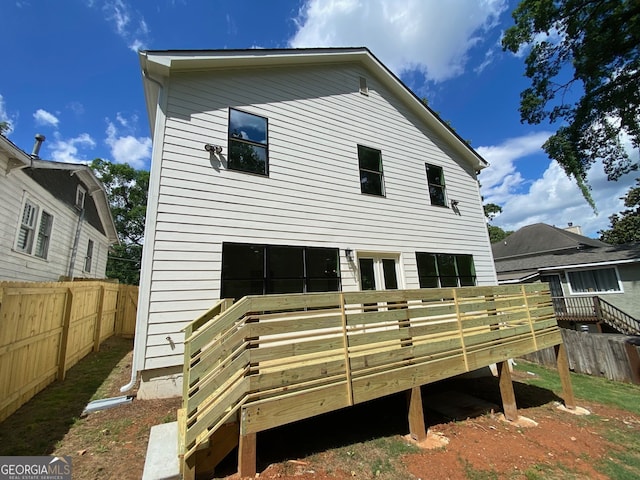 2167 Main St NW, Atlanta, GA 30318 - rear view of property with a wooden deck and fence