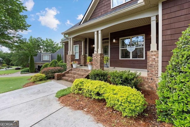 property entrance with covered porch