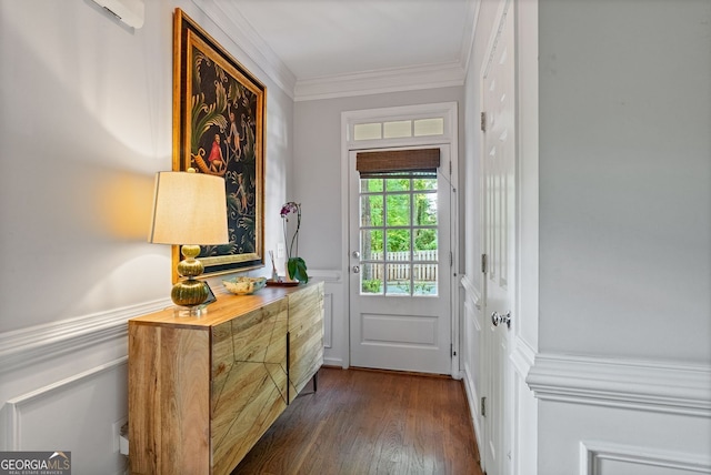 entryway featuring wainscoting, dark wood-style flooring, crown molding, and a decorative wall