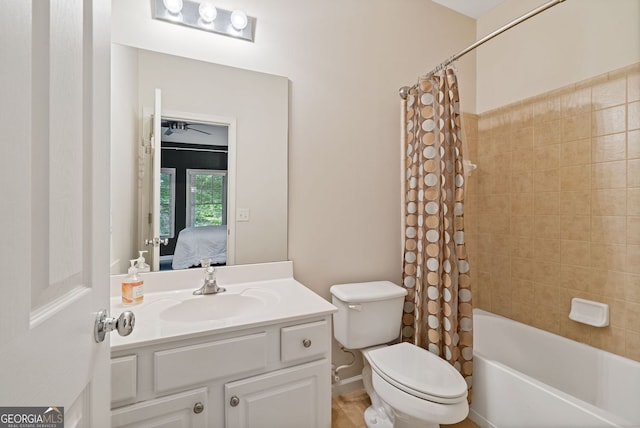 bathroom featuring vanity, toilet, ensuite bathroom, and shower / bath combo