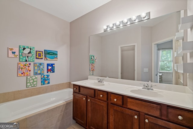 full bath with a sink, double vanity, and a garden tub