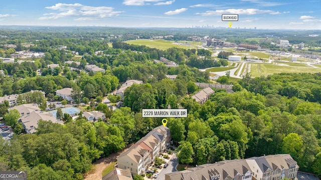 birds eye view of property with a residential view