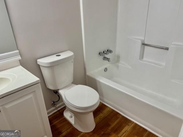 3988 Chimney Ridge Dr, Ellenwood, GA 30294 - bathroom with toilet, wood finished floors, vanity, and shower / bath combination