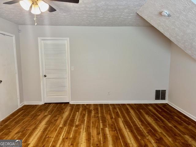 3988 Chimney Ridge Dr, Ellenwood, GA 30294 - additional living space featuring hardwood / wood-style flooring, a textured ceiling, visible vents, a ceiling fan, and baseboards