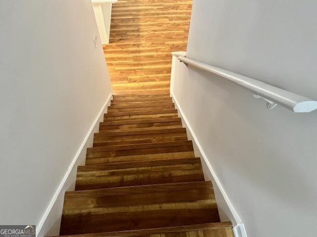 3988 Chimney Ridge Dr, Ellenwood, GA 30294 - staircase featuring wood finished floors