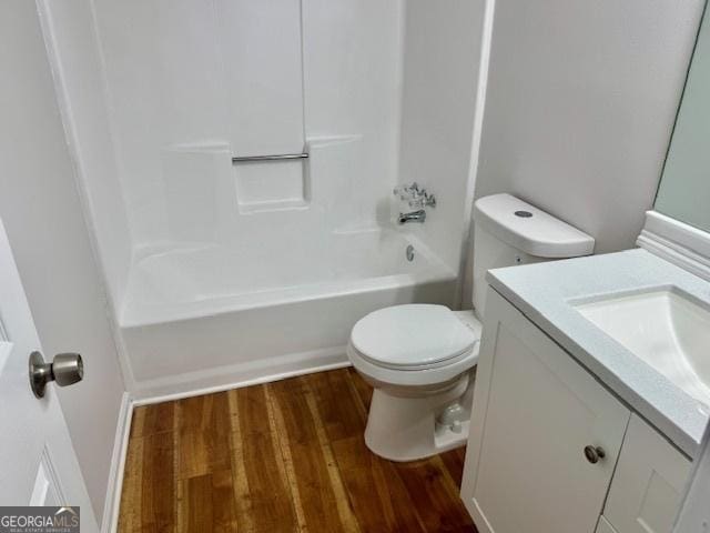 3988 Chimney Ridge Dr, Ellenwood, GA 30294 - bathroom with toilet, vanity, shower / tub combination, and wood finished floors