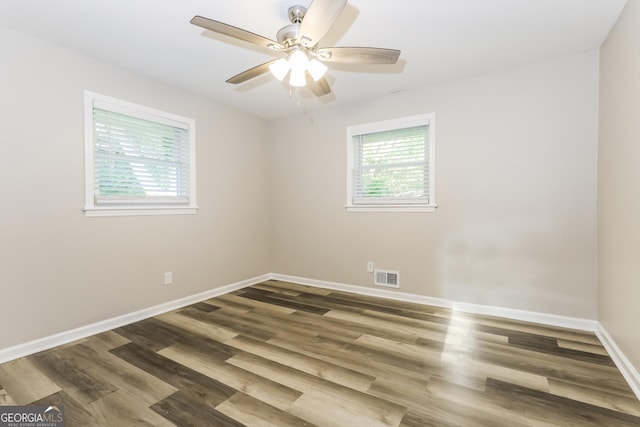 338 Mount Zion Rd, Hapeville, GA 30354 - empty room with ceiling fan, plenty of natural light, and wood finished floors