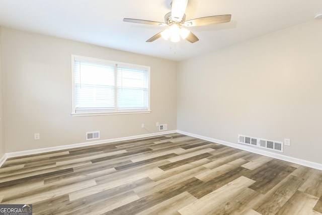 338 Mount Zion Rd, Hapeville, GA 30354 - spare room featuring a ceiling fan, visible vents, and wood finished floors