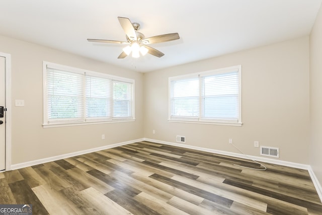 338 Mount Zion Rd, Hapeville, GA 30354 - spare room featuring dark wood finished floors, visible vents, baseboards, and ceiling fan