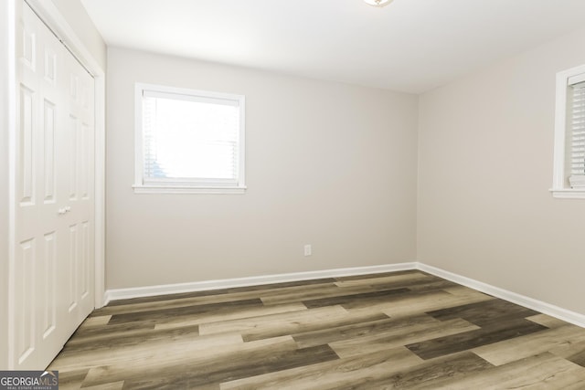 338 Mount Zion Rd, Hapeville, GA 30354 - unfurnished bedroom with a closet, wood finished floors, and baseboards